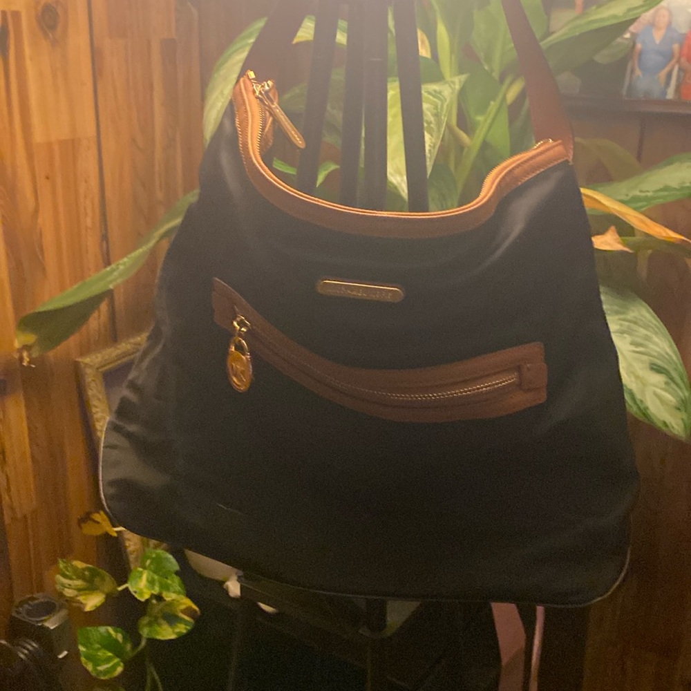 Black nylon Michael Kors handbag in good condition with brown trimmer